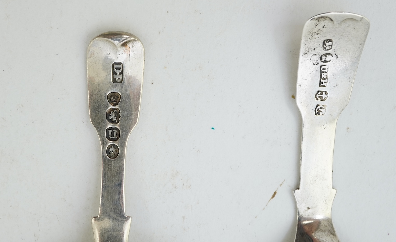 A collection of ten assorted mainly 19th century silver and white metal fiddle pattern caddy spoons